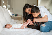 mom with newborn and son